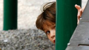 Excluded boy on a playground